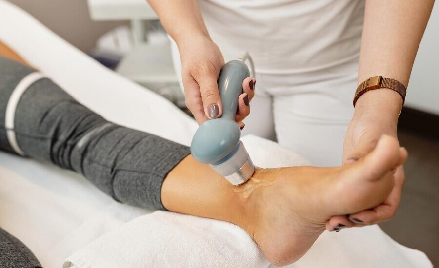 closeup-physical-therapist-treating-client-s-joint-with-electrotherapy_