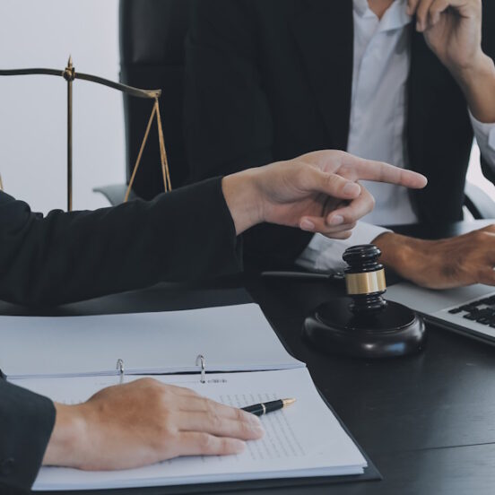 a labor lawyer consults with their client