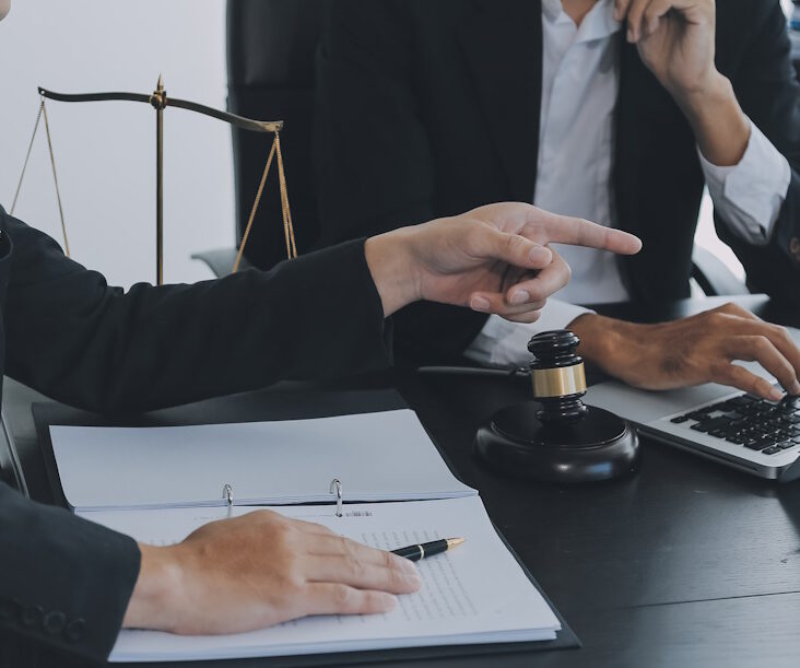 a labor lawyer consults with their client