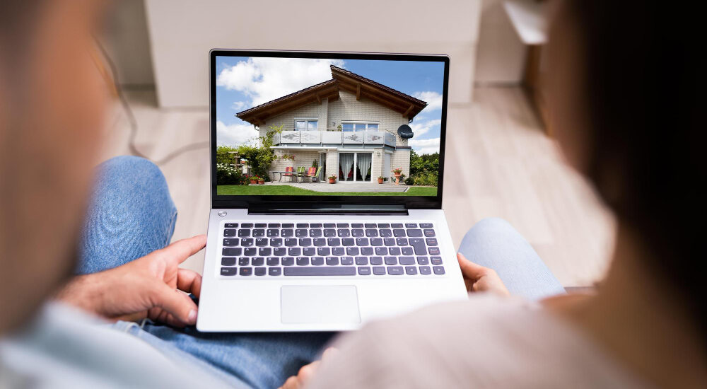 Couple looking at houses online