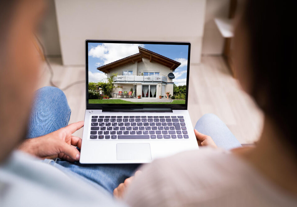 Couple looking at houses online