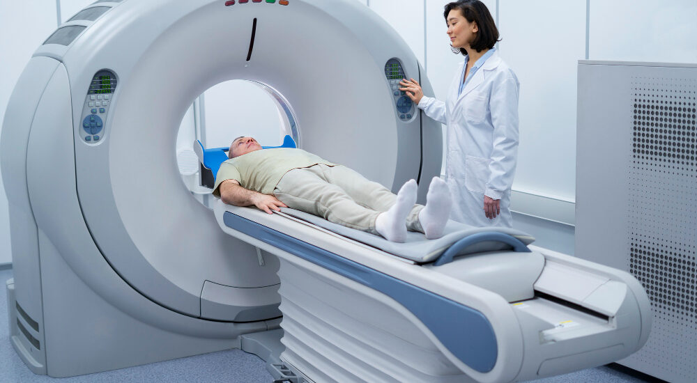 Doctor performing a CT scan on a patient