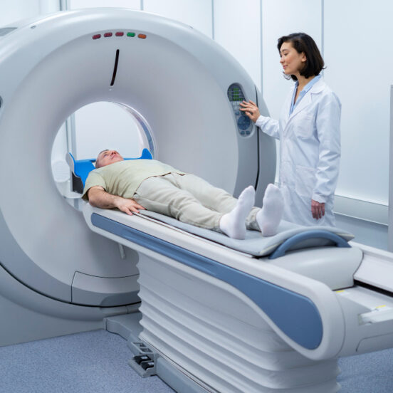 Doctor performing a CT scan on a patient