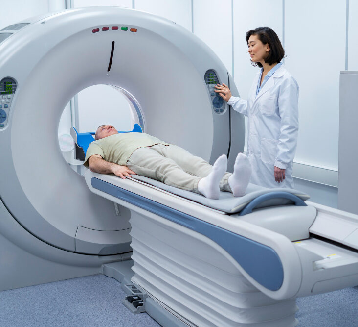 Doctor performing a CT scan on a patient
