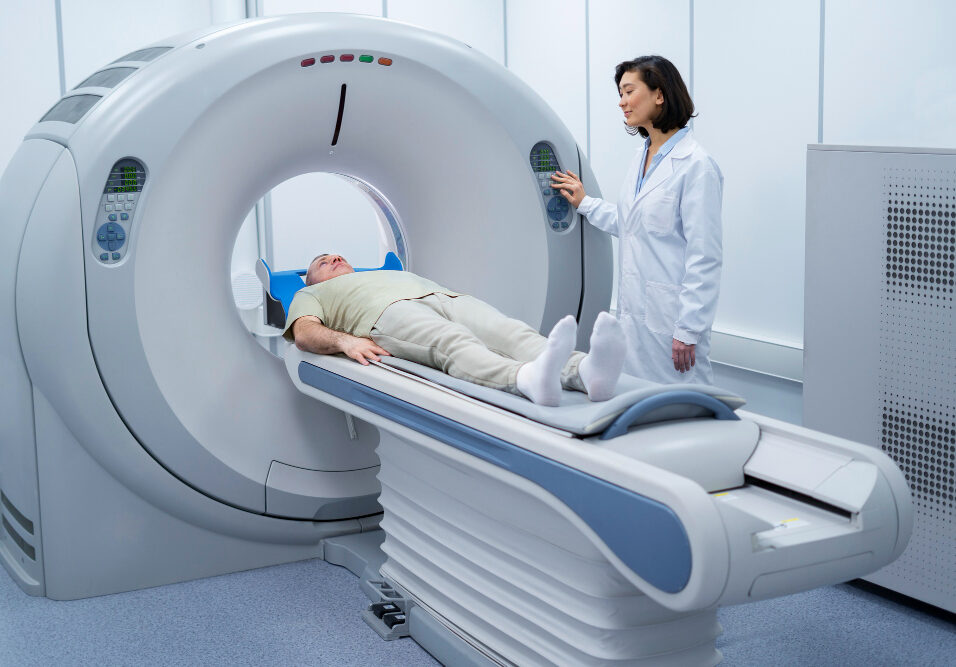 Doctor performing a CT scan on a patient