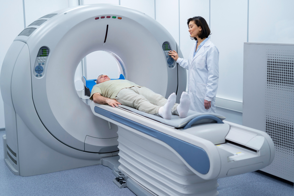 Doctor performing a CT scan on a patient